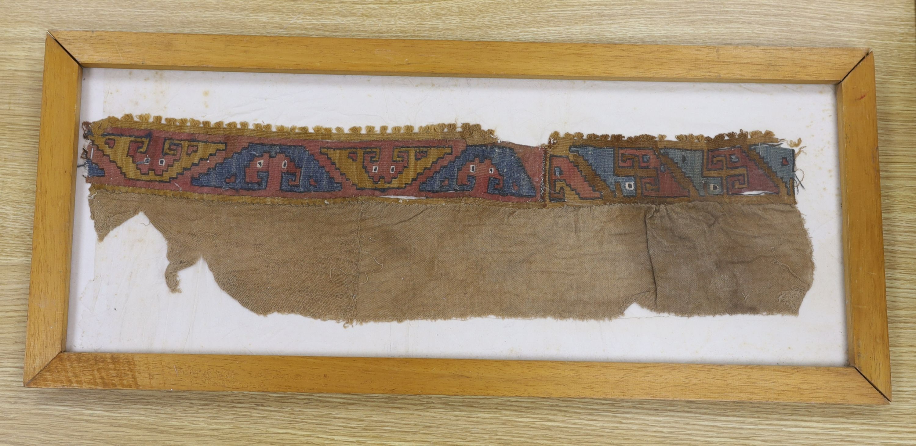 A pre-Columbian grave textile, framed